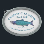 Boucle De Ceinture Ovale Bar et Grill Saumon Cyanotique<br><div class="desc">Un Saumon Sockeye aux tons bleus avec le texte "Cyanotic Saumon Bar & Grill Kenai, Alaska" et "Combat Fishing Rest And Relaxation. La pêche au saumon est très populaire, trop populaire en Alaska. Imaginez des centaines de pêcheurs, à peu près côte à côte, longeant les deux rives d'un ruisseau essayant...</div>