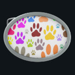 Boucle De Ceinture Ovale Empreintes de pattes de chiens colorés partout<br><div class="desc">Des images d'empreintes de pattes de chiens partout. Design de dessins animés colorés. Boucles de ceinture personnalisées. Idée cadeau pour les amoureux de les chiens de tous âges.</div>