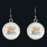 Boucles D'oreilles Livres floraux<br><div class="desc">Montrez votre amour pour la littérature avec la pile de Fleur sauvage et de livres de boucles d'oreilles, un accessoire charmant et élégant pour les amateurs de livres et les épouses-à-être. Dotés d'une délicate aquarelle peinte à la main illustrant des livres vintages en rose, bleu, vert et or, ces boucles...</div>