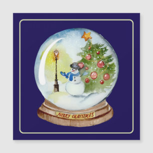 Boule à neige de Noël avec bonhomme de neige et ar