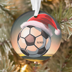 Boule de football avec chapeau rouge Père Noël
