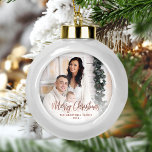 Boule En Céramique Joyeux Noël Famille Photo Rose Gold Script<br><div class="desc">Faites passer des vacances à des amis et à la famille avec ce ornement de gardien moderne. Le texte en fausse feuille d'or rose dit "Joyeux Noël" dans un élégant script d'écriture manuscrite. Remplacez l'exemple d'image par votre photo préférée, et ajoutez votre nom de famille et l'année. Un filtre en...</div>