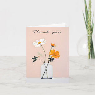 Bouquet minimaliste dans un pot en verre Merci