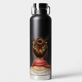 BOUTEILLE D'EAU FEMME AVEC DES LUMIÈRES DE NOËL COLORÉES DANS SES