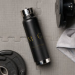 Bouteille D'eau Stylish Monogram With Couple Name Black<br><div class="desc">Elevate your hydration with this stylish black water bottle featuring a custom monogram and couple names. Sleek and durable,  it’s perfect for daily use,  special events,  or gifting. Combines practical functionality with personalized charm for a modern,  memorable accessory.</div>