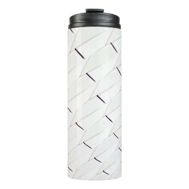 Bouteilles Isothermes A pattern of white geometric shapes in a facade (Devant)