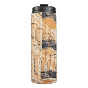 Bouteilles Isothermes An old yellow house with wrought-iron balconies. f