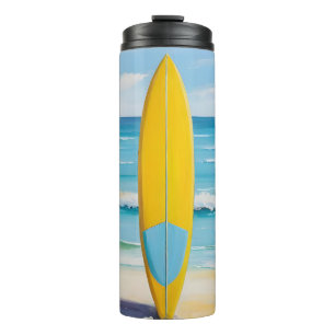 Bouteilles Isothermes Planche de surf bleue et jaune sur la plage