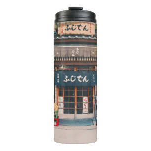 BOUTEILLES ISOTHERMES TROIS BICYCLETTES PARKÉES DEVANT L'ÉDIFICE