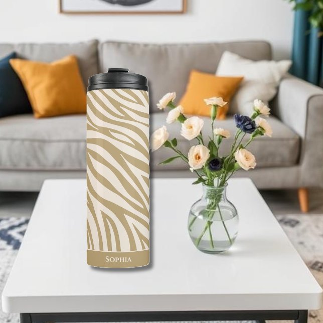 Bouteilles Isothermes Zèbre imprimé beige (Sip in Style with Our Neutral Zebra Print Thermal Tumbler – Where Chic Meets Function.
Stay hydrated)