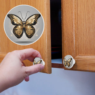 Bouton De Porte En Céramique Papillon doré majestueux sur gris