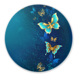 Bouton De Porte En Céramique Papillons d'or sur un Arrière - plan bleu