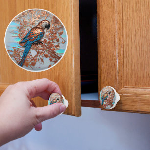 Bouton De Porte En Céramique Perroquet cuivre et bleu sur une branche