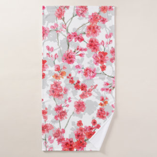 Branches de fleurs de cerisiers sur le fond blanc