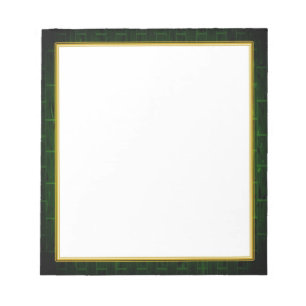 Brique verte sur le petit bloc-notes blanc