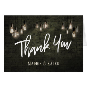 Briques industrielles Merci avec éclairage Edison