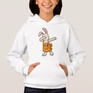 Bunny comme coiffeur avec peigne et ciseaux