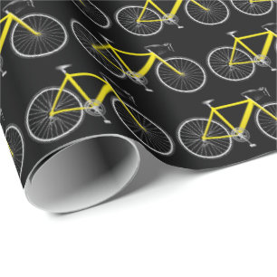 Cadeau bicyclette jaune sur papier d'emballage noir