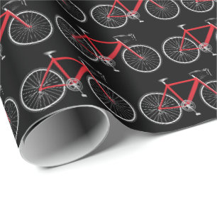 Cadeau bicyclette rouge sur papier d'emballage noir