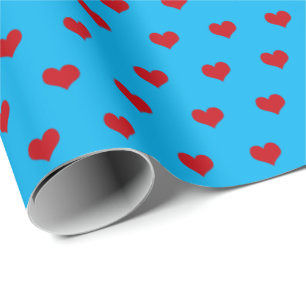 Cadeau coeur rouge sur papier d'emballage aqua