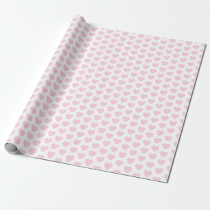 Cadeau Coeurs, rose-clair sur le papier d'emballage blanc