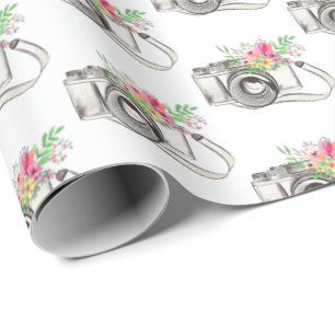 Cadeau Fleurs et caméra sur papier blanc