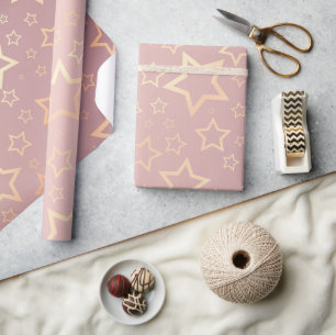 Cadeau papier d'emballage rose aux étoiles dorées