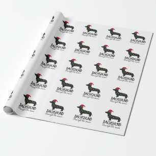 Cadeau Teckel par le papier d'emballage de neige