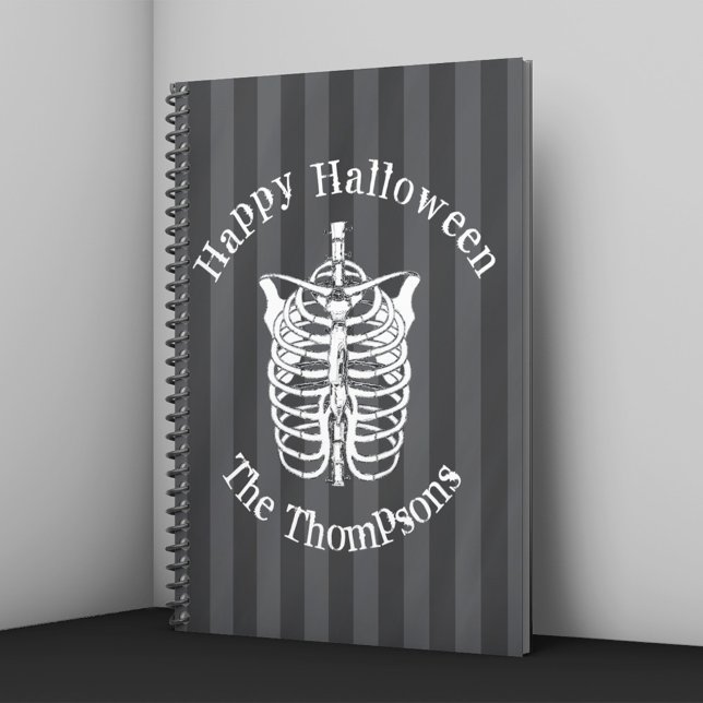 Cahier de Halloween personnalisé avec squelette (Halloween notebook with skeleton ribcage illustration and striped background personalized with name.)