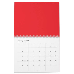 Calendrier crayons rouges et oranges couchés côte à côte sur 