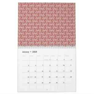 Calendrier Tissus rouges et roses posés sur un tapis à motif 