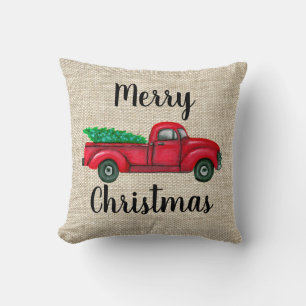 Camion rouge vintage avec le coussin d'arbre de