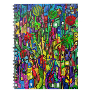 Carnet Arbre fleuri dans une mer de maisons.