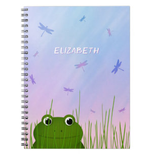 Carnet caricature grenouille regarder sur l'herbe dragonf