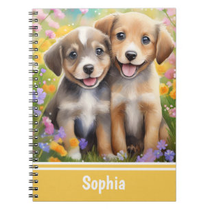 Carnet Chiens mignons de chiots dans la prairie fleurie