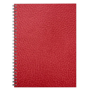 Carnet Closeup en cuir artificiel rouge foncé.