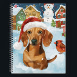 Carnet Dachshund Winter Wonderland Christmas Joy<br><div class="desc">Ce design festif reflète l'esprit joyeux de la période des fêtes, avec un adorable petit portant un chapeau de Père Noël. Le chien est niché dans un pays des merveilles hivernales, avec un bonhomme de neige, un sapin de Noël décoré et des cadeaux joliment emballés. Les flocons de neige tombent...</div>