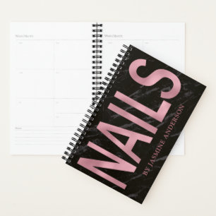 Carnet de rendez-vous en or rose et en marbre noir