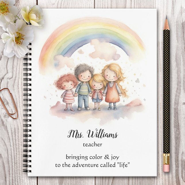 Carnet Enseignant Enfants Arc-en-ciel Aquarelle (Cute teacher notebook featuring a watercolor painting of children hand in hand under the rainbow.)