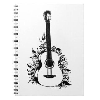 Carnet Guitare acoustique sur un arrière - plan de fleurs