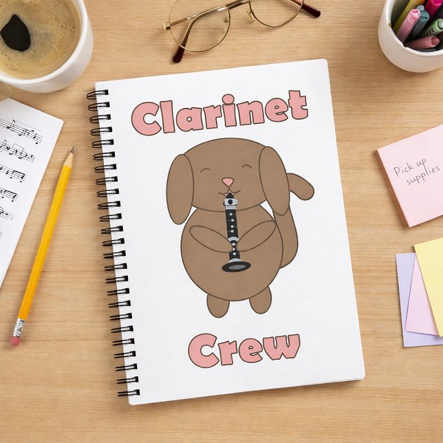 Carnet Joli chien brun jouant de la clarinette (A notebook with a brown dog playing clarinet and the words clarinet crew.)