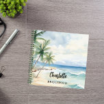 Carnet Mariage à la plage de Bridesmaid<br><div class="desc">Plage tropicale,  vagues et palmiers,  aquarelle. Personnalisez et ajoutez le nom de votre servante. Script de style manuscrit noir.</div>