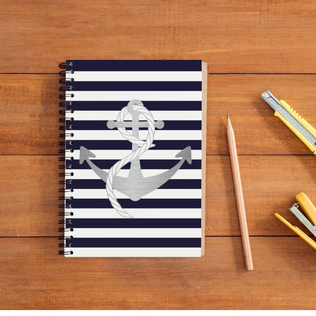 Carnet Nautique Striqué (The perfect nautical notebook for a sailor. A silver anchor on a blue and white striped background.)