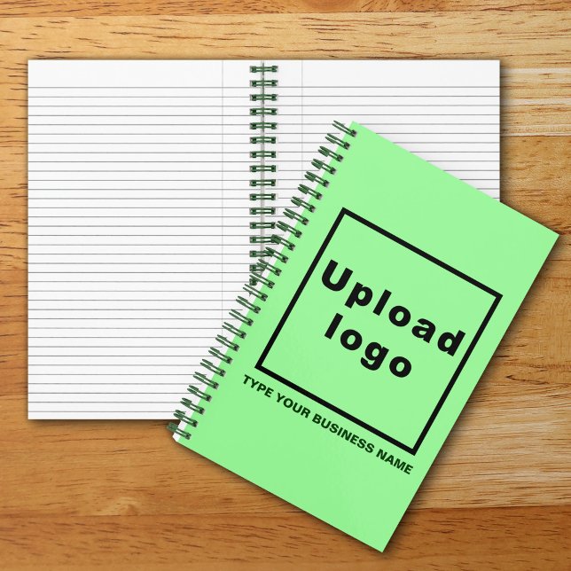 Carnet Nom de l'entreprise et logo sur la spirale verte (Build brand name awareness. Your business logo and name on light green cover of spiral notebook.)