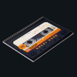 Carnet Orange Retro Audiotape 70th birthday Guest Book<br><div class="desc">Old audio cassette to personalize with your name and date. Design on spiral notebook with text for 70th Birthday party guest book in horizontal orientation. You can easily change text (font, color, size and position) by clicking the customize button. Available in hard cover guest book. Matching birthday save the date...</div>