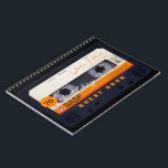 Carnet Orange Retro Audiotape 70th birthday Guest Book<br><div class="desc">Old audio cassette to personalize with your name and date. Design on spiral notebook with text for 70th Birthday party guest book in horizontal orientation. You can easily change text (font, color, size and position) by clicking the customize button. Available in hard cover guest book. Matching birthday save the date...</div>