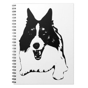 Carnet Plans à côté d'un Corgi