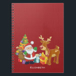 Carnet Santa and Reindeer par Christmas Tree with Present<br><div class="desc">Une jolie illustration avec l'esprit de fête. Le Père Noël portant son sac cadeau et saluant. Son ami renne à ses côtés, suspendu par un sapin décoré, avec des cadeaux tout autour. Placez-vous sur un arrière - plan rouge avec des cercles fantaisistes. Design festif et gai. Personnalisez avec un nom...</div>