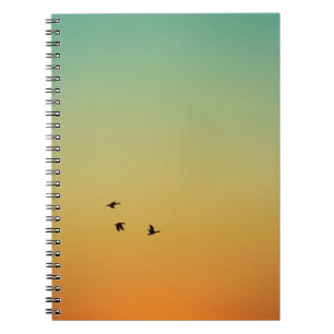 CARNET SILHOUETTE D'OISEAUX VOLANT PENDANT LE COUCHER DU