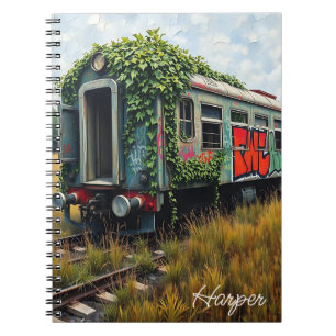 Carnet Train abandonné recouvert de lierre et de graffiti
